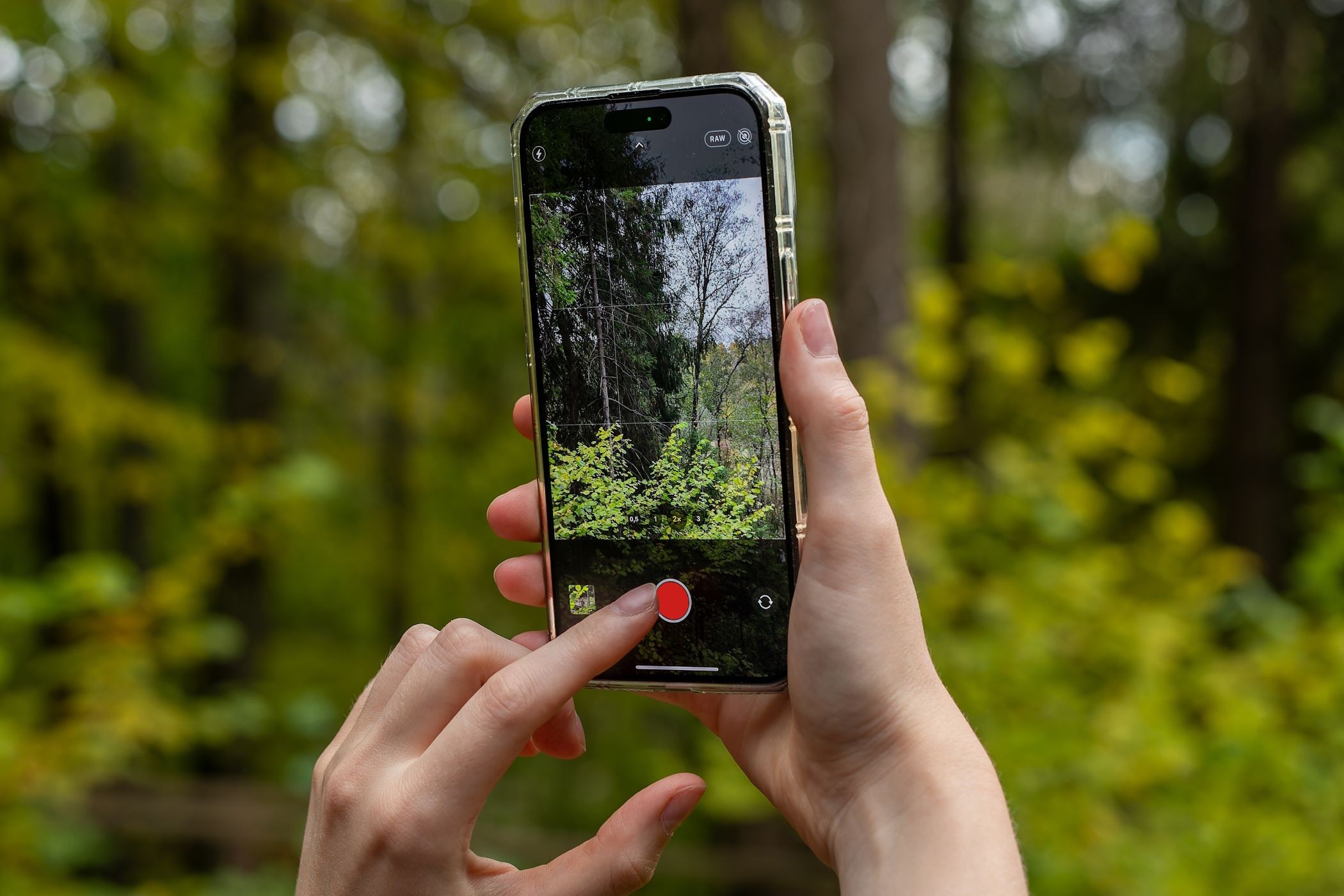 A woman shooting a video with her iPhone 14 Pro Max