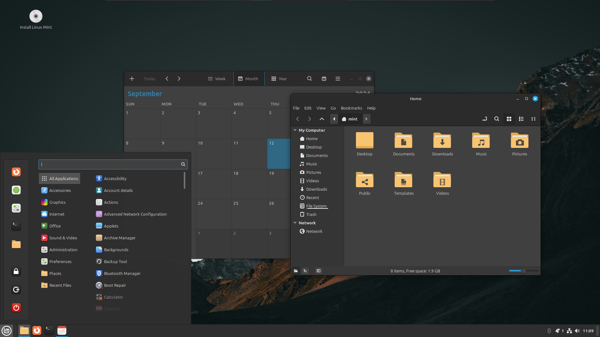 Màn hình desktop của Linux Mint với ứng dụng lịch và trình duyệt tệp đang mở