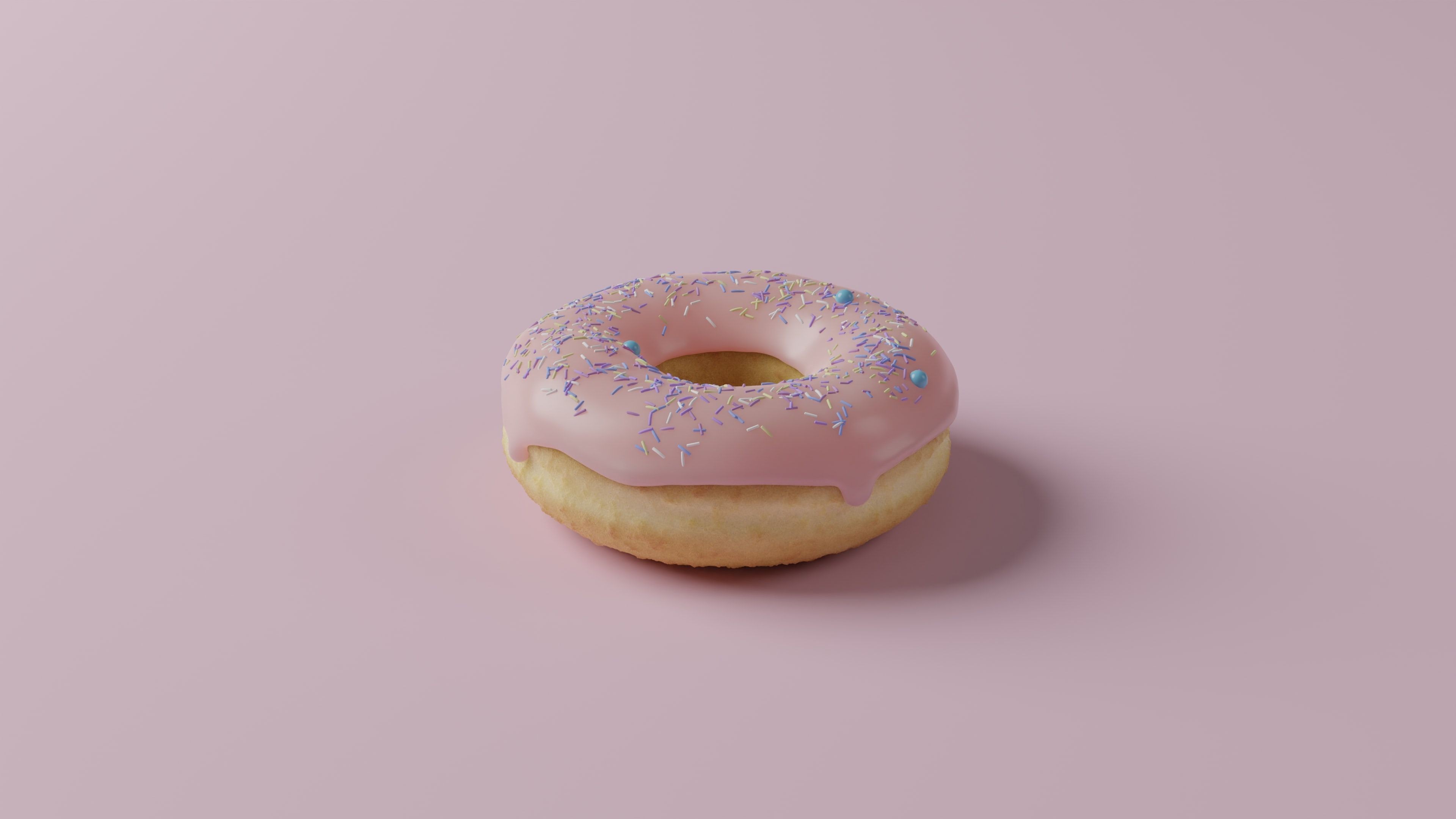 Mô hình 3D của bánh donut với lớp phủ màu hồng và rắc