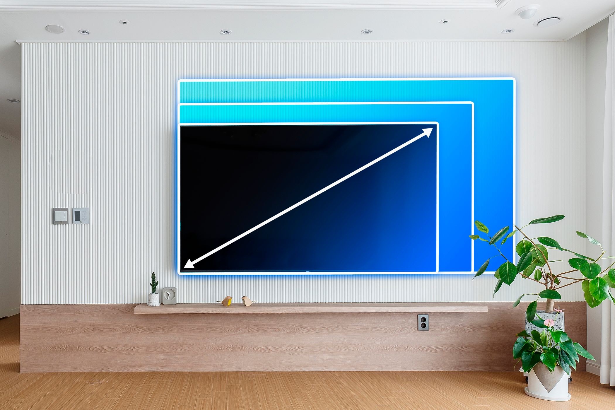 Một phòng khách với tivi và các đường kẻ đánh dấu kích thước tivi khác nhau